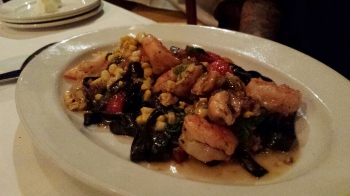 My friend's Fettuccine "Nero"-- with gulf shrimp, mussels, charred sweet corn, Covey Rise Farms tomatoes, pancetta, urchin-scampi fondue